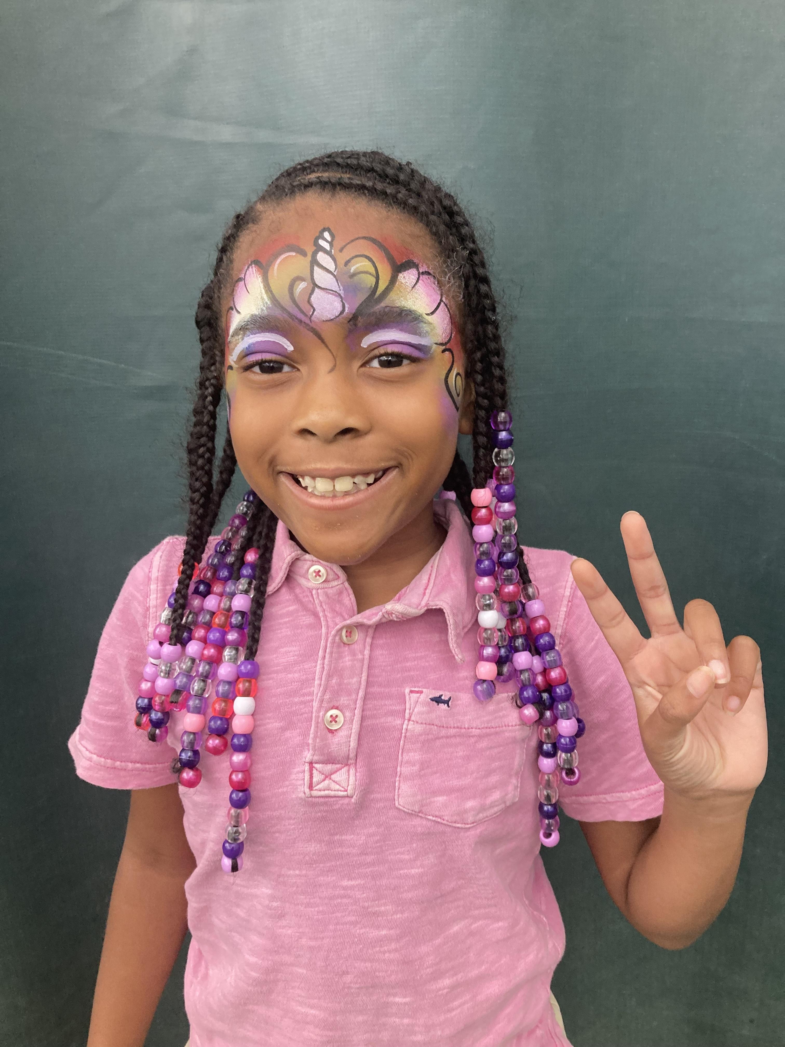 Unicorn princess making peace sign